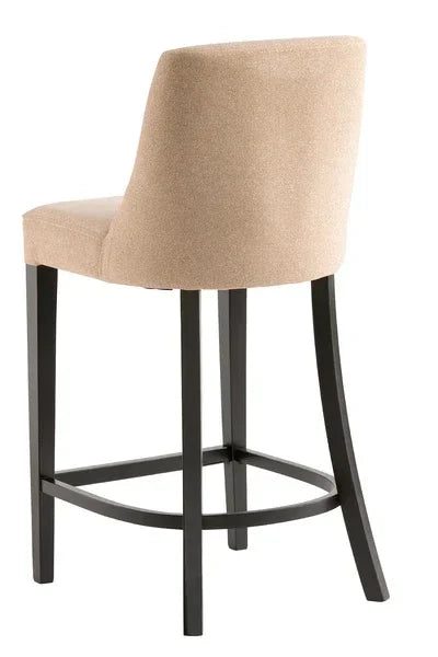 Beige upholstered bar stool with curved back and dark wooden legs, rear angle view