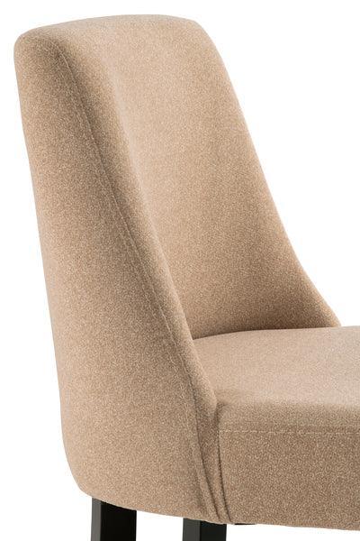 Beige fabric dining chair with high curved back and black wooden legs, side angle