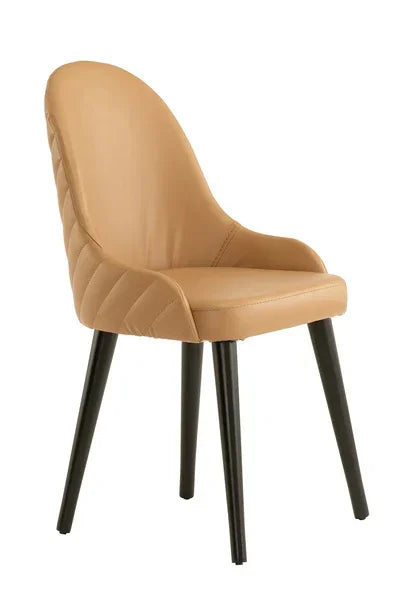 Tan upholstered dining chair with black legs and quilted backrest
