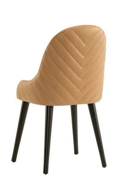 Tan upholstered dining chair with chevron stitching and black legs, rear angle view