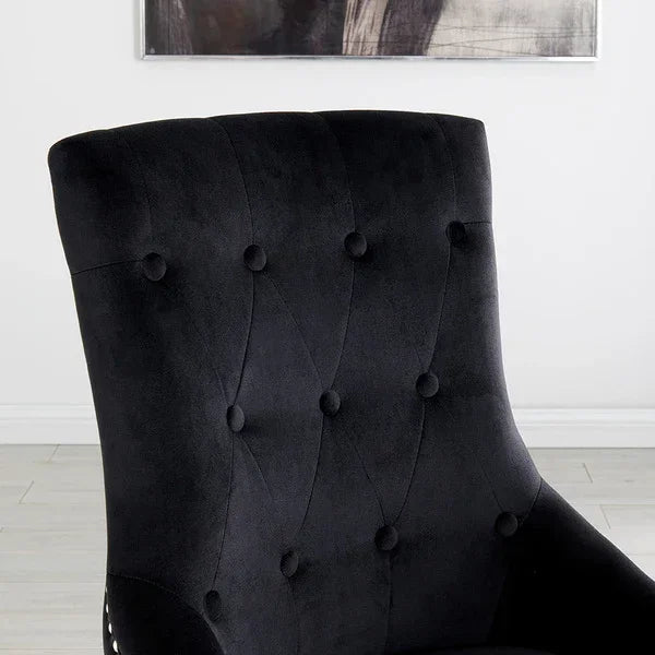 Black velvet dining chair with tufted backrest in modern interior