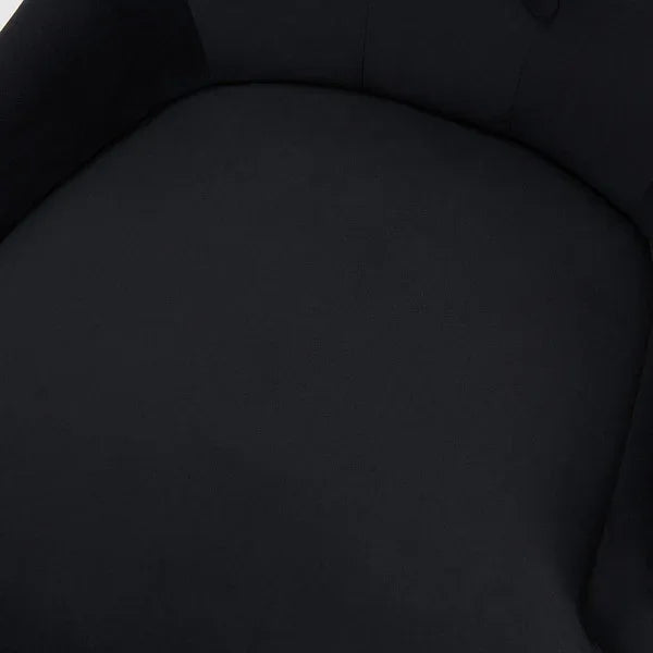 Close-up of black fabric seat cushion on modern armchair