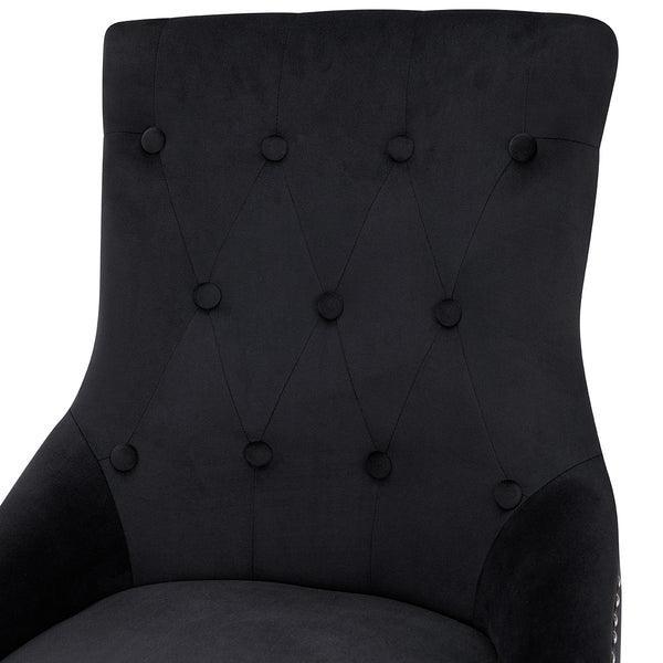 Black upholstered accent chair with tufted button backrest detail