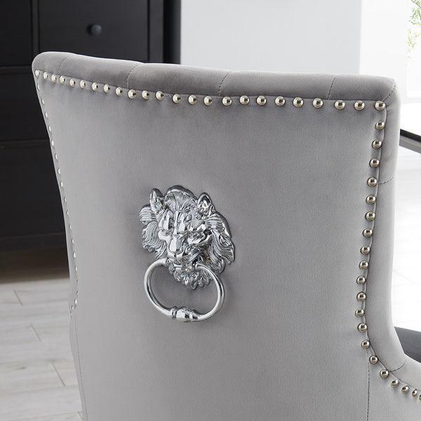 Grey velvet dining chair with silver lion knocker and studded trim detail