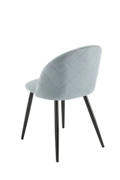 Light grey dining chair with quilted fabric back and black angled legs, rear view