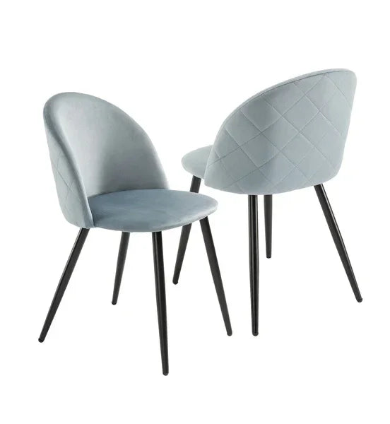 Set of two modern grey velvet dining chairs with black metal legs and quilted backrests