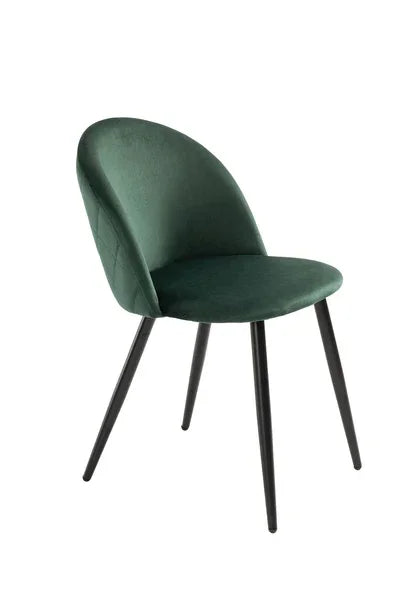 Green velvet dining chair with curved backrest and black metal legs