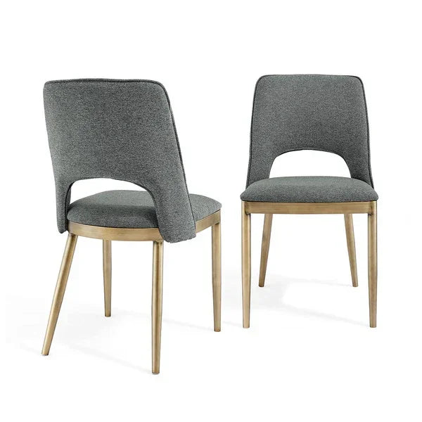 Pair of grey fabric dining chairs with cut-out backrest and light wood legs