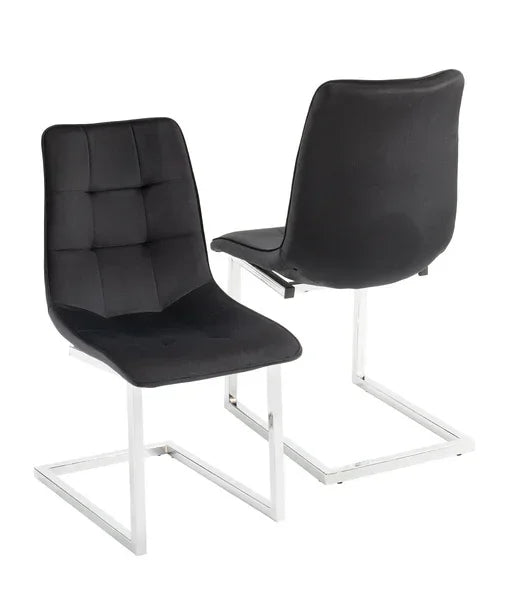 Black dining chairs with chrome cantilever legs and tufted seat detail, front and back view