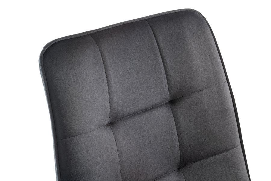 Close-up of grey fabric dining chair backrest with square stitched pattern