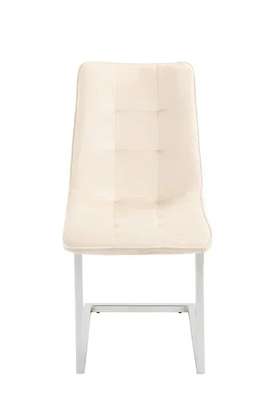 Cream dining chair with cushioned seat and metal legs, front angle view
