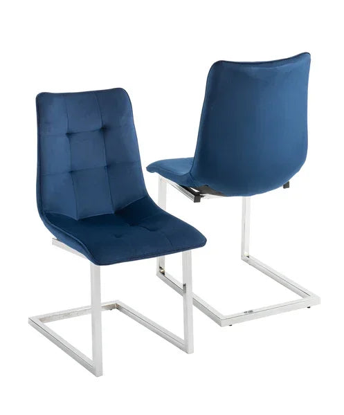 Blue velvet dining chairs with chrome legs, front and rear angles shown