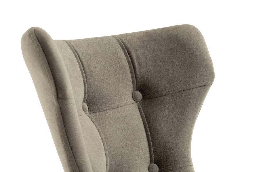 Closeup of a grey fabric dining chair with button-tufted backrest