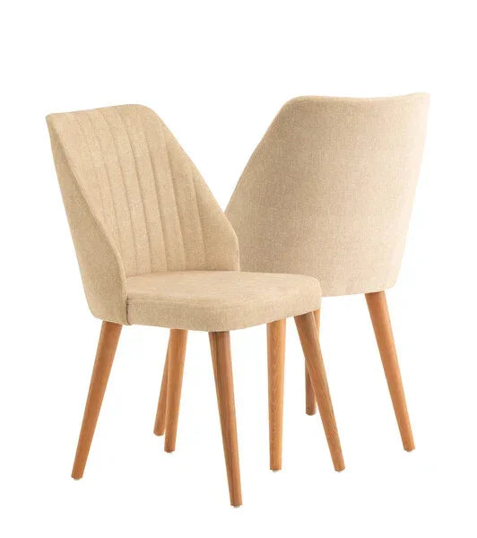 Pair of beige fabric dining chairs with wooden legs, front and angled rear view