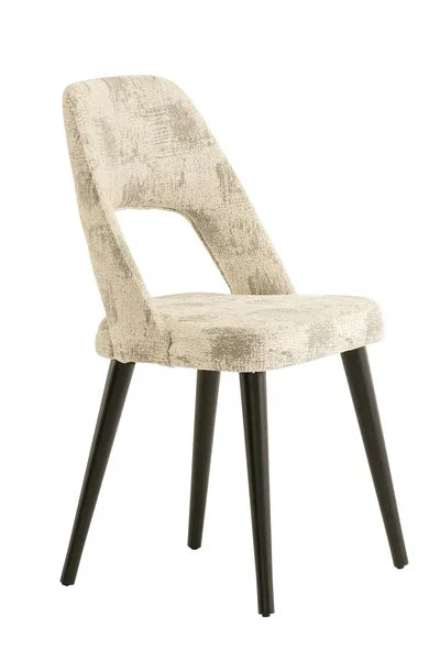 Modern dining chair with beige fabric upholstery and black tapered metal legs