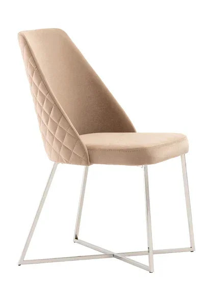Beige velvet dining chair with quilted back and chrome legs, side angle view