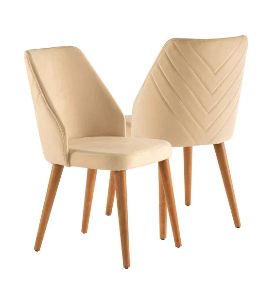 Cream velvet dining chairs with wooden legs and chevron stitched backs