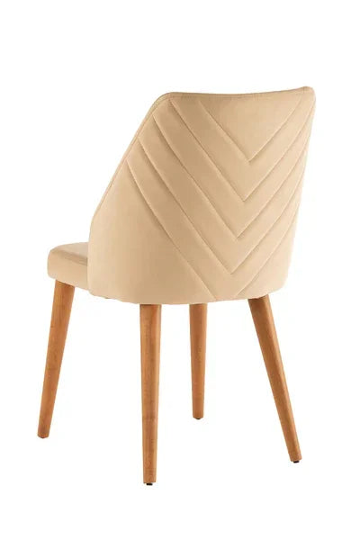 Beige velvet dining chair with chevron stitching and wooden legs rear view
