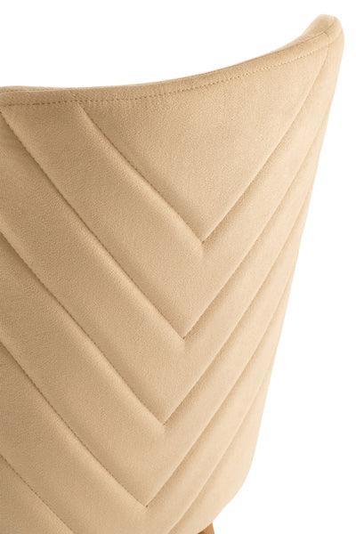 Beige velvet dining chair backrest with chevron stitching detail