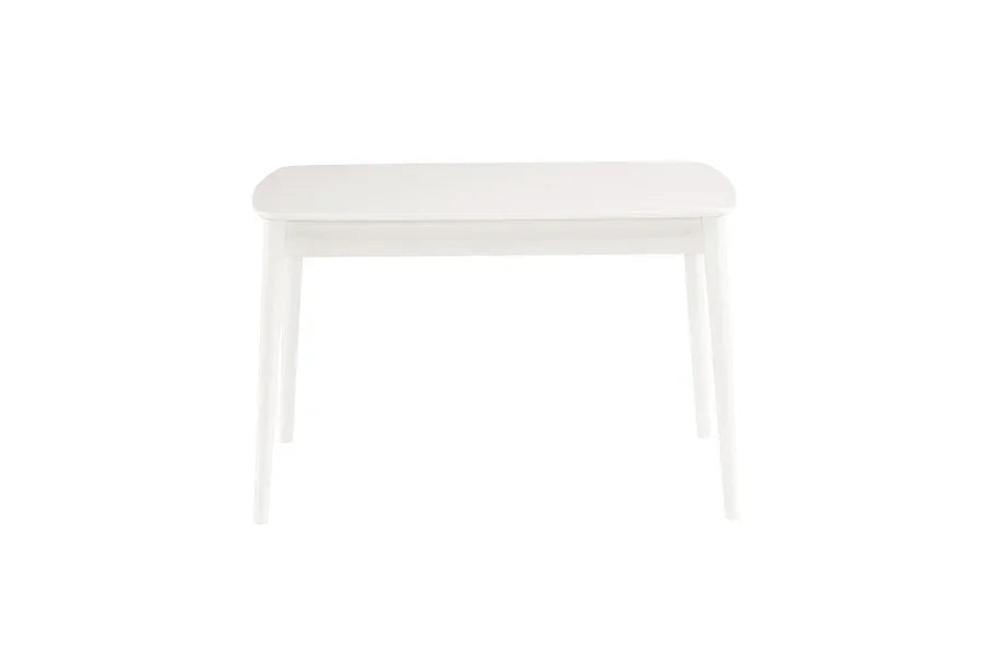 White wooden dining table with rounded edges and tapered legs, front view