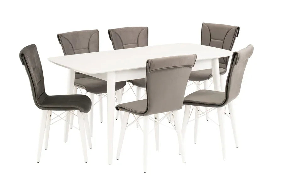 White rectangular dining table with six grey padded chairs and angled white legs