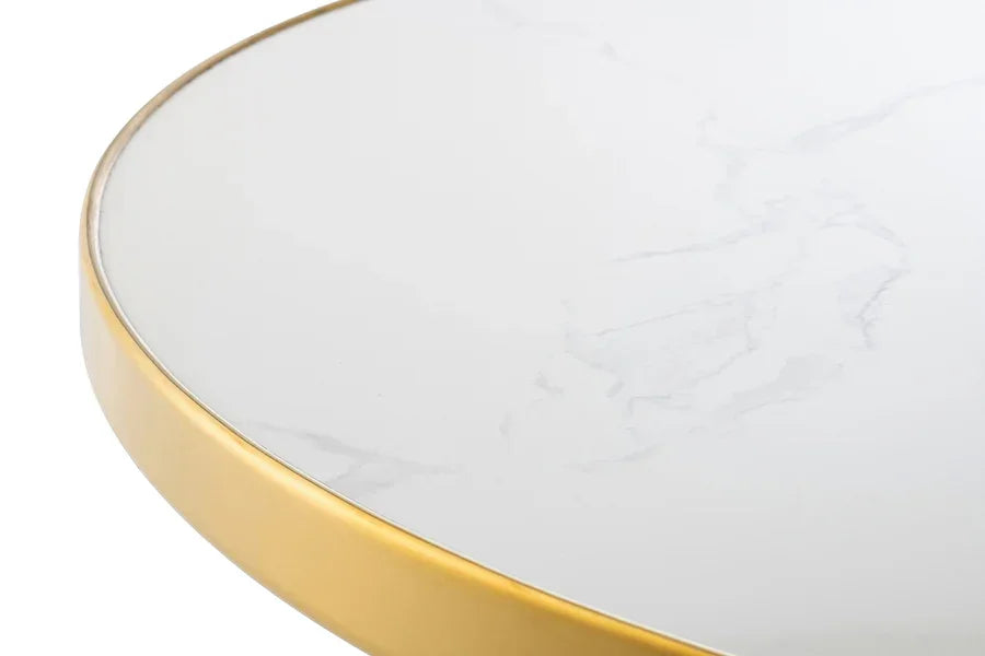 Round marble coffee table with gold metal frame, close up of tabletop surface