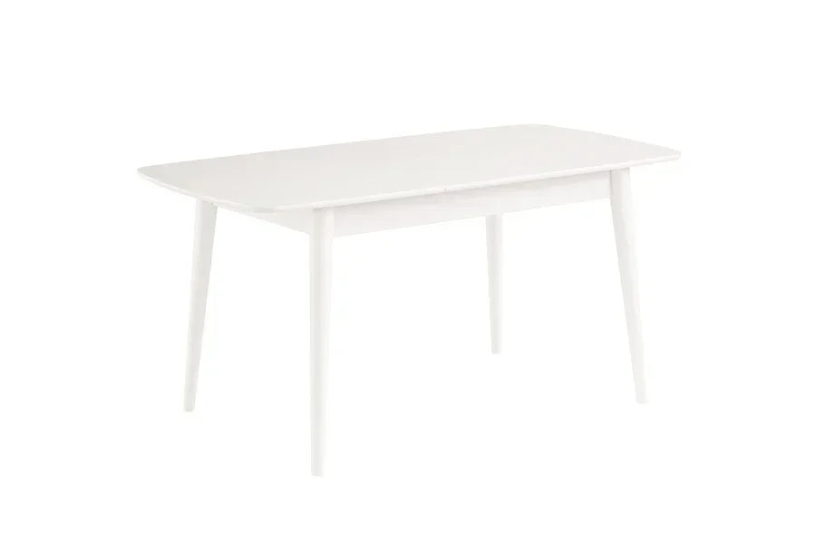 White rectangular dining table with rounded edges and tapered legs