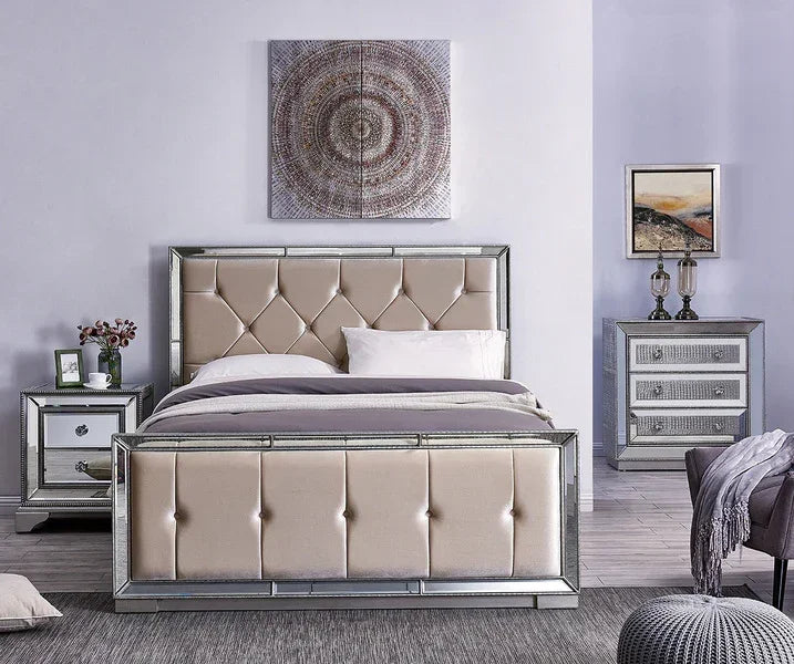 Mirrored bed frame with champagne upholstered headboard in modern bedroom with matching bedside tables