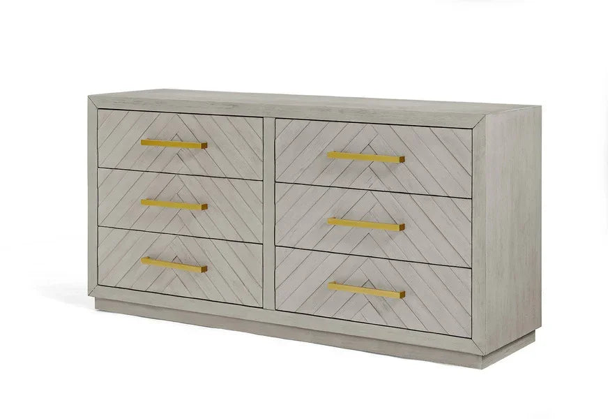 Light wood chest of drawers with chevron pattern and gold handles