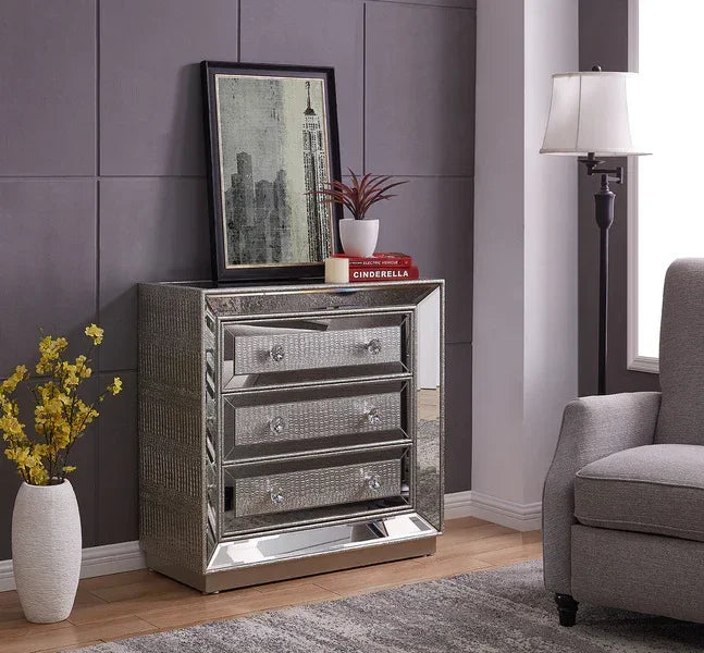 Mirrored chest of drawers with crystal knobs in a modern living room corner