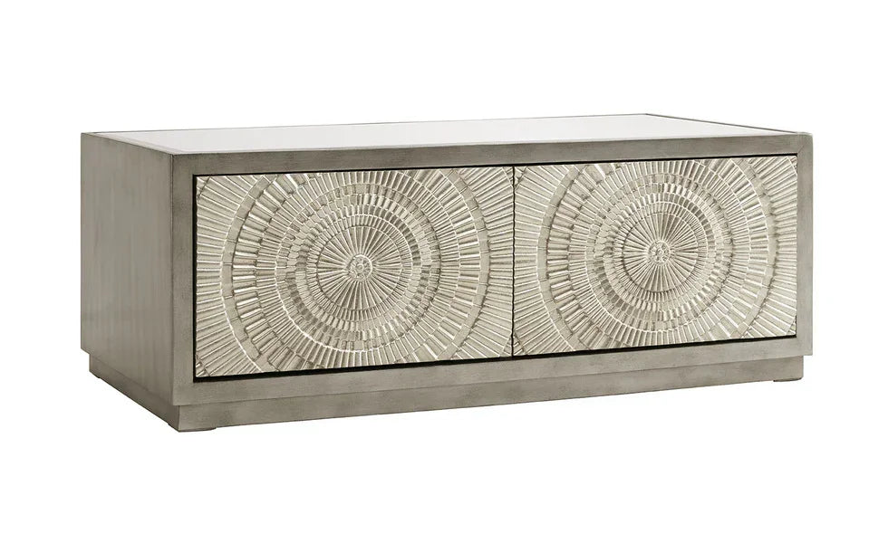 Silver coffee table with textured circular carved drawer fronts and rectangular shape