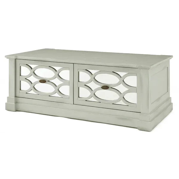 White wooden storage bench with decorative mirrored front panels and oval patterns