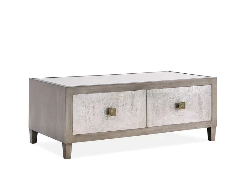 Wooden coffee table with two textured front drawers and gold square handles, angled view