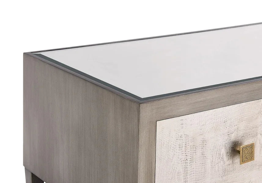 Wooden bedside table with glass top and gold drawer handle, shown from side angle