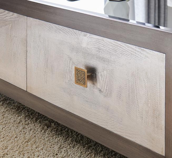 Modern wooden sideboard with brushed panel and brass square handle on textured carpet