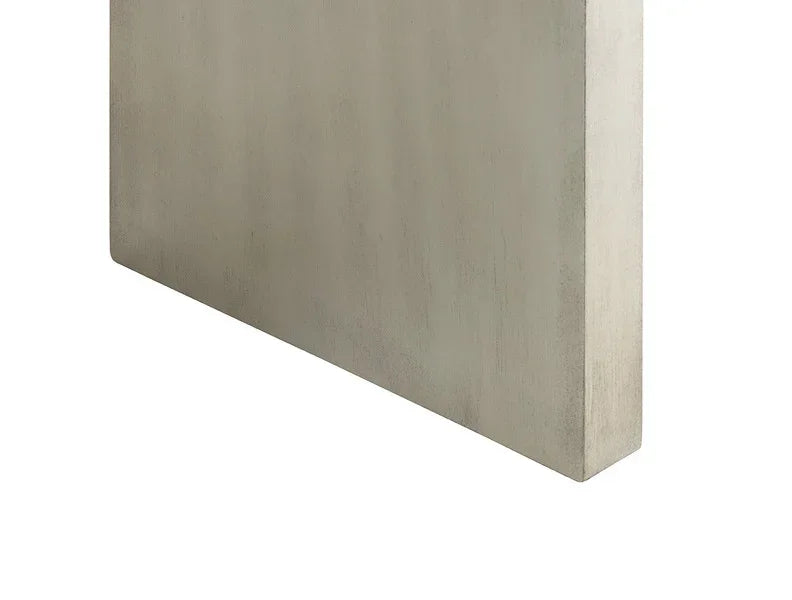 Rectangular wooden table top with a light oak finish, close-up side angle