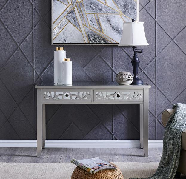 Silver console table with mirrored panels and decorative items in modern living room