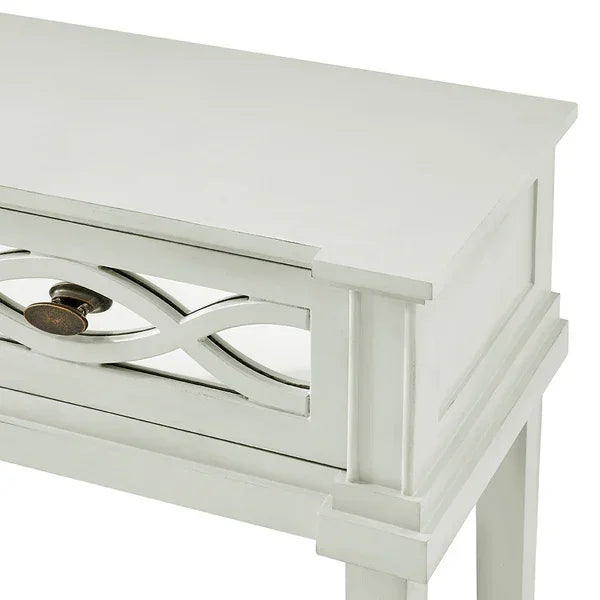 White wood console table with decorative drawer front and vintage metal knob