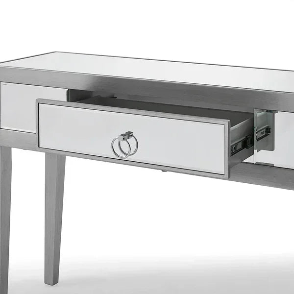 Mirrored console table with single drawer and metal ring handles, shown from the front side angle