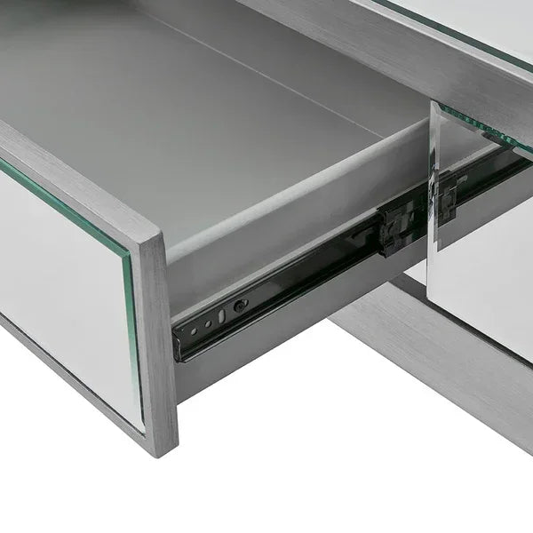 Closeup of mirrored drawer with metal frame and smooth sliding mechanism on furniture unit