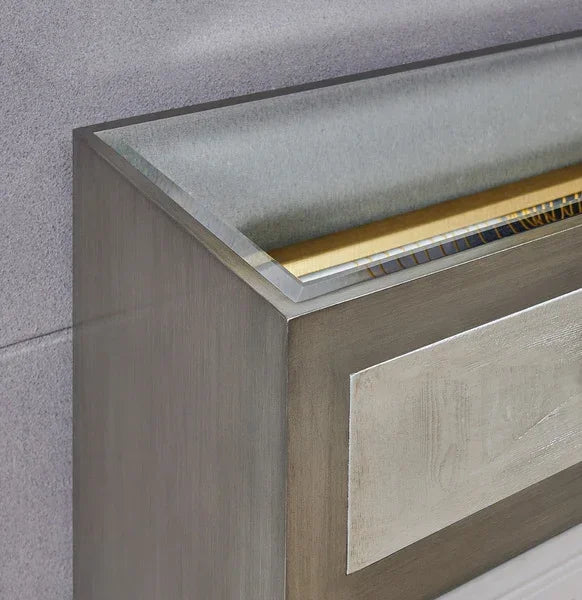 Rectangular brushed metal planter with mosaic tile trim against grey wall
