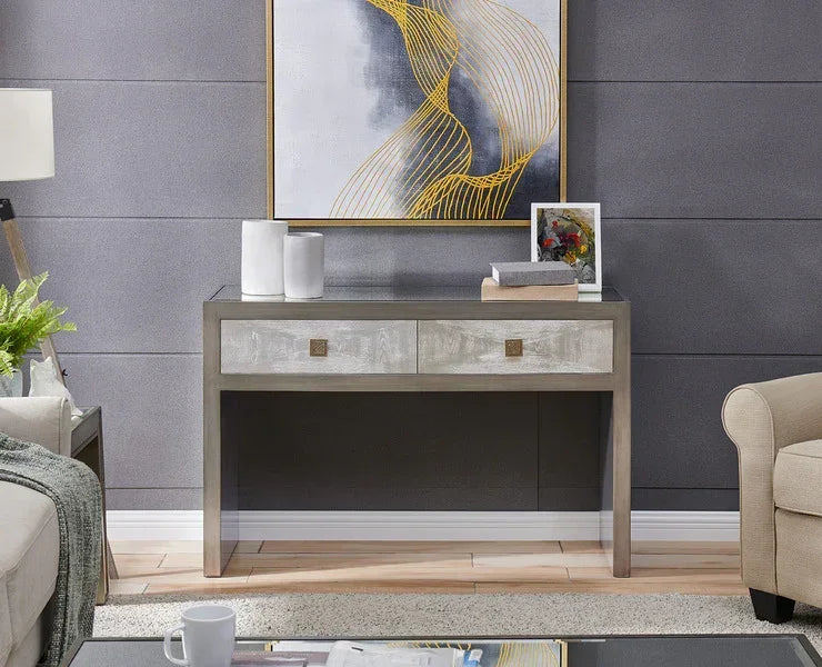 Modern console table with two drawers and decorative accents in a living room setting