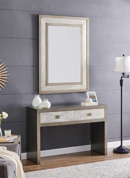 Modern console table with two drawers, matching wall mirror, and decorative vases in hallway