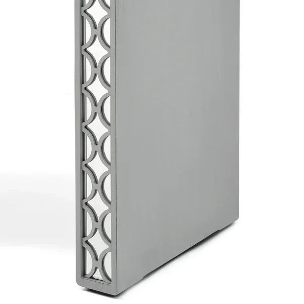 Grey furniture panel with geometric cut-out side detail, viewed at an angle