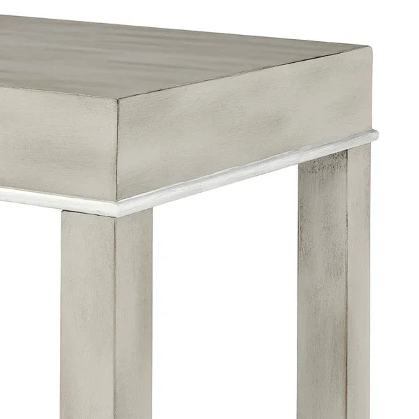 Close view of light grey wooden table corner with clean lines and square legs