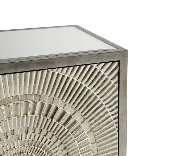 Modern silver side table with geometric carved front panel and mirrored top
