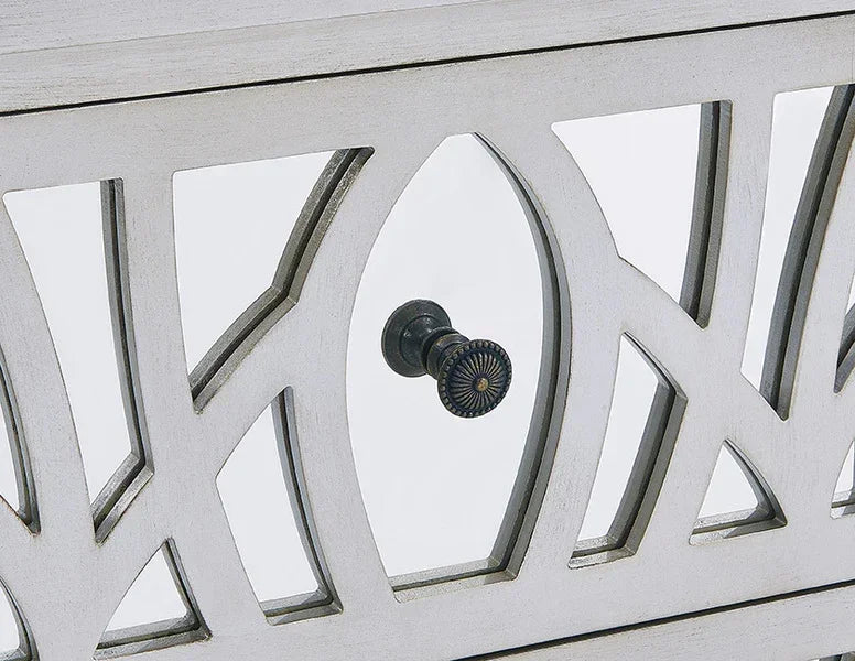 White wooden cabinet door with decorative geometric glass panel and black knob handle