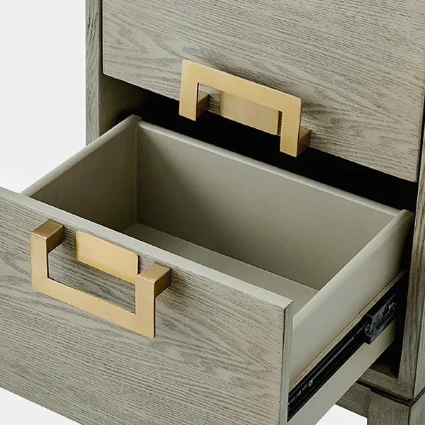 Wooden drawer unit with gold metal handles and smooth sliding mechanism