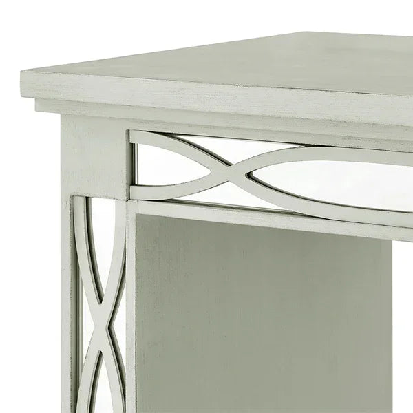 White wood side table with open shelf and decorative cross pattern detail