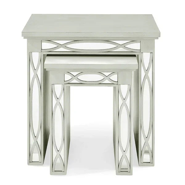 Silver mirrored nest of tables with geometric frame design, set of two stacked together